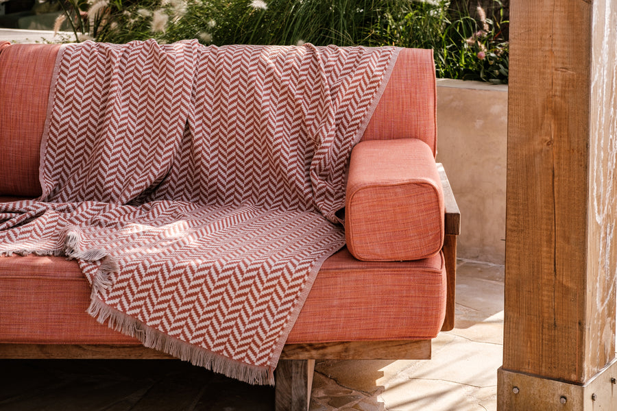 Luxury Turkish cotton throw in rich terracotta, paired with artisan salted caramel popcorn and a Dyori signature gift bag — an elegant festive gift set for cozy winter comfort