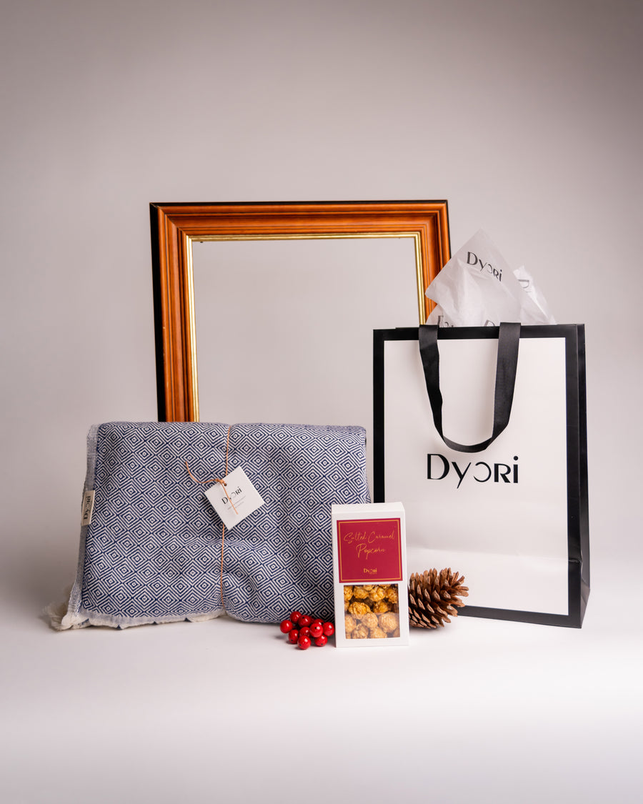 Turkish cotton blue diamond weave blanket with Dyori gift bag and salted caramel popcorn.