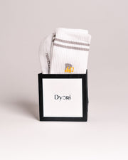 White socks with gray stripes in a black box featuring the 'Dyori' brand on a light gray background. Secret Santa Gifts