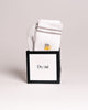 White socks with gray stripes in a black box featuring the 'Dyori' brand on a light gray background. Secret Santa Gifts