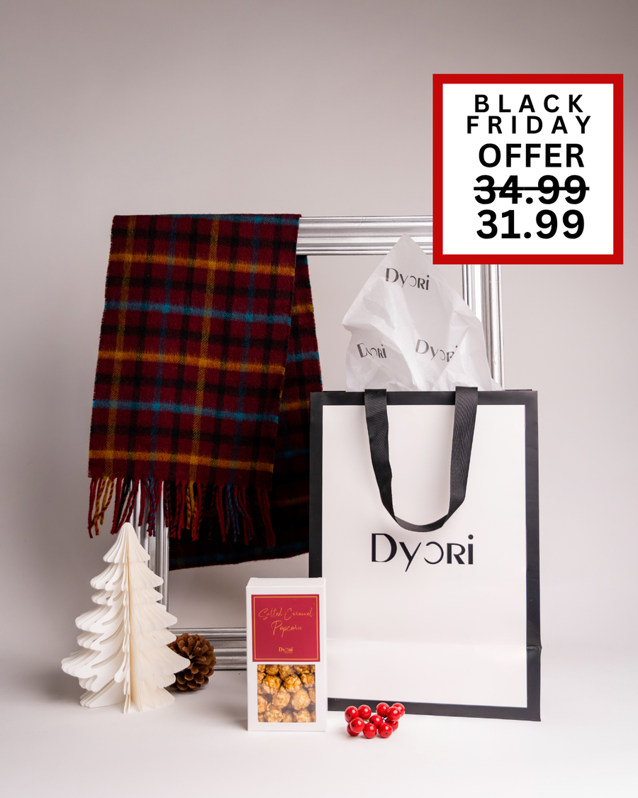 Elegant Dyori Christmas gift set featuring a red and blue check scarf, salted caramel popcorn, and a luxury gift bag. Ideal for Black Friday shopping, this festive gift is perfect for anyone who loves cozy, stylish, and delicious gifts in Malta.