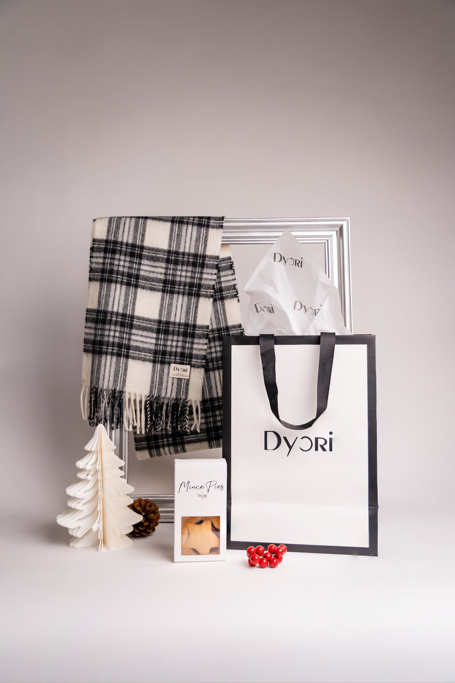 Chic and cozy, Dyori’s monochrome merino wool scarf is the ideal winter accessory for festive elegance.