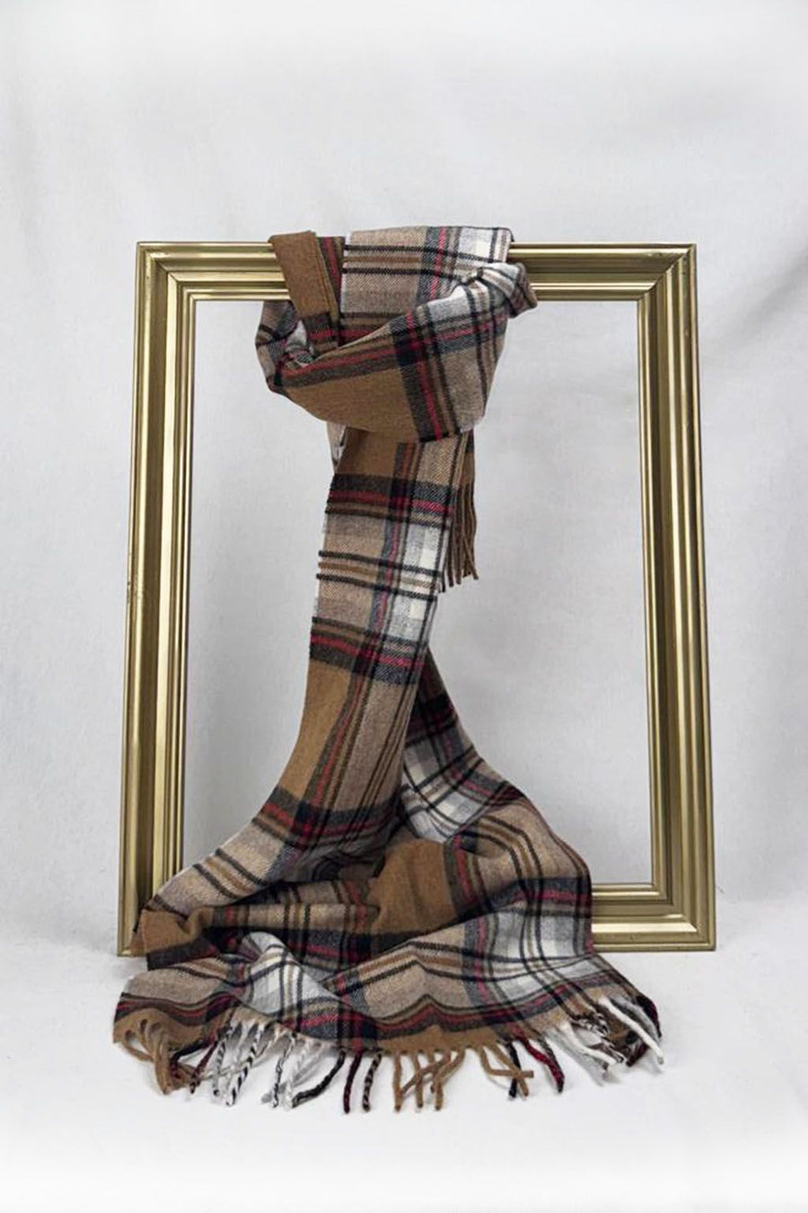 A soft wool-like plaid scarf featuring warm brown and red hues, tied gracefully on a gold frame. This timeless design makes an ideal gift for teachers, offering both elegance and comfort, beautifully wrapped and delivered across Malta