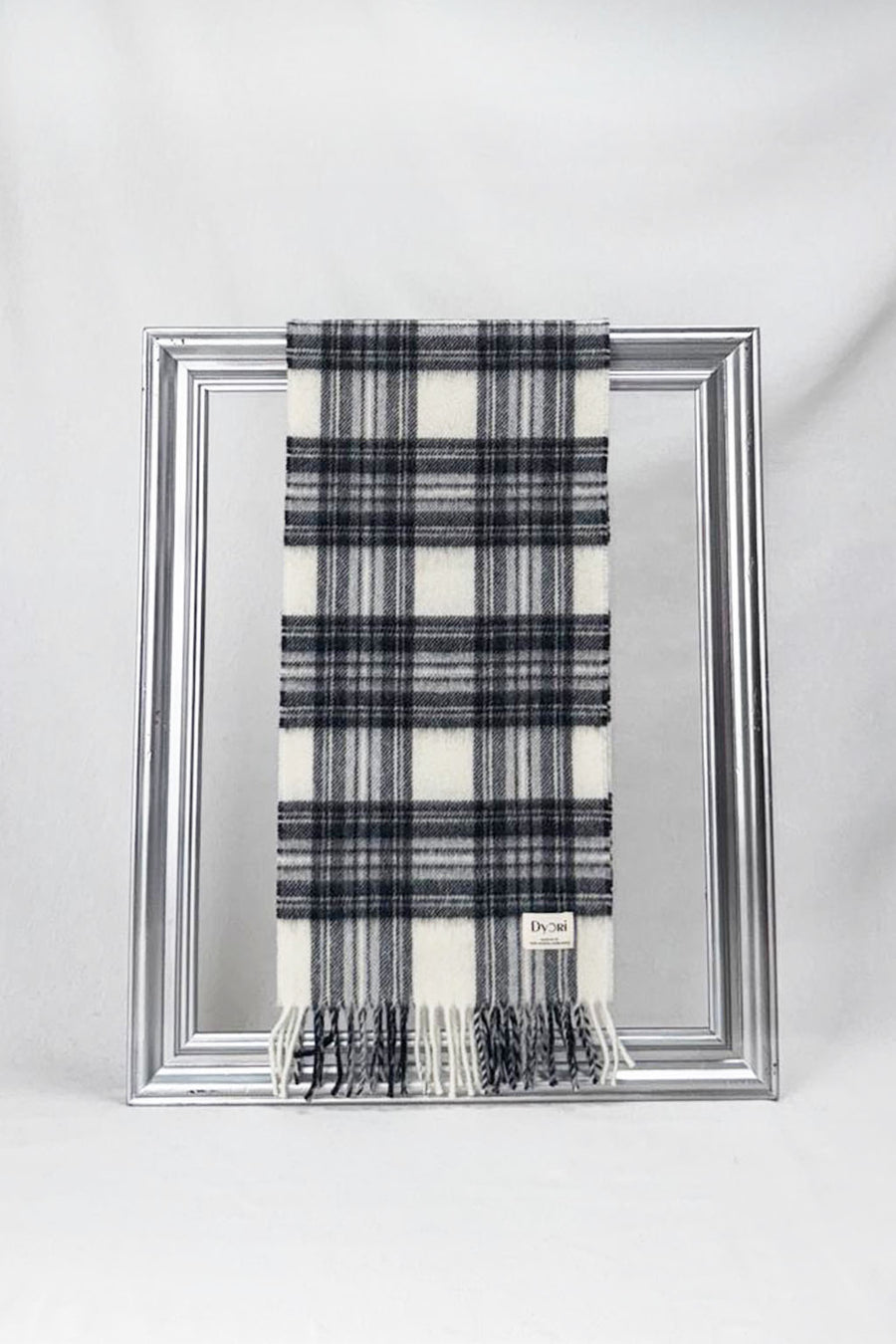 Premium merino wool scarf featuring a crisp white base with grey checks. Lightweight, durable, and elegant — an ideal unisex gift for the colder months.