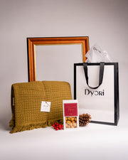 Elegant cotton throw in a rich golden hue, beautifully paired with gourmet salted caramel popcorn and presented in a luxury Dyori gift bag. The perfect sustainable Christmas gift in Malta for men, women, teachers, or corporate clients with local delivery.