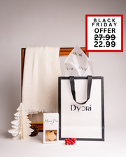 A soft cream Dyori scarf paired with festive mince pies and a luxury bag. A simple yet elegant Christmas gift option available during Black Friday in Malta.