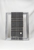 A sophisticated dark grey plaid wool scarf featuring beige and navy checkered patterns is neatly draped over a silver frame against a clean white background. The scarf’s refined design and soft texture showcase timeless winter fashion — a warm and elegant gift for him, available with delivery across Malta.