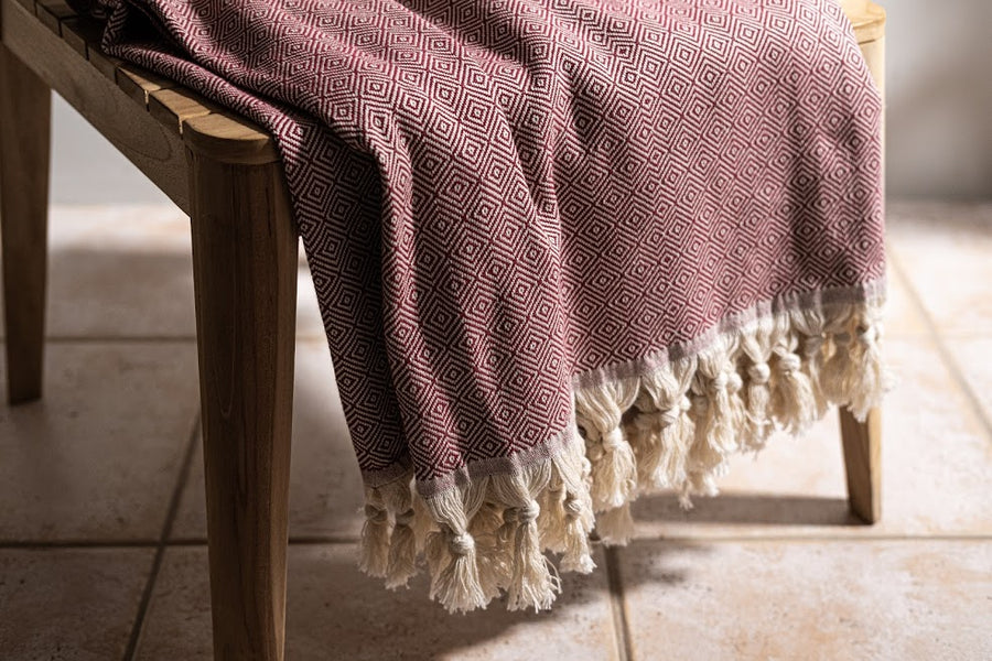 Turkish cotton burgundy diamond weave blanket with Dyori gift bag and salted caramel popcorn.