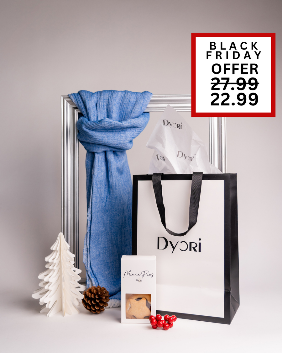 A cozy blue scarf featured with Dyori’s branded bag and festive mince pies. A timeless luxury Christmas gift set in Malta, reduced for Black Friday from €27.99 to €22.99.