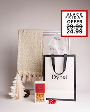 Chic and festive Dyori gift set including a soft cream patterned throw, salted caramel popcorn, and a premium gift bag. A beautiful Black Friday gift for those who appreciate comfort, style, and a touch of luxury.