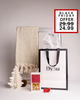 Chic and festive Dyori gift set including a soft cream patterned throw, salted caramel popcorn, and a premium gift bag. A beautiful Black Friday gift for those who appreciate comfort, style, and a touch of luxury.