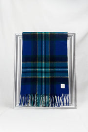 Beautifully woven merino wool scarf featuring a rich blue and green check design with fine fringes. Warm, elegant, and ideal as a gift for him or her. Available for delivery across Malta.