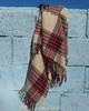 Premium beige merino wool scarf with red and blue check design. Lightweight, stylish, and warm — the perfect accessory to elevate your winter wardrobe.
