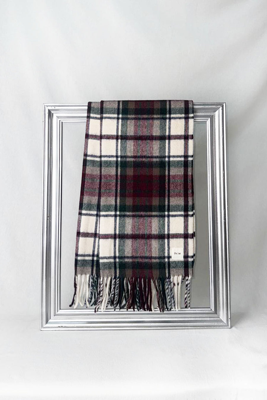 Premium merino wool scarf featuring a classic cream base with burgundy and green checks. Finely woven with soft fringes — a timeless unisex accessory for him or her. Delivered in Malta.