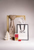 A luxury beige cotton scarf beautifully presented with festive packaging, ideal for eco-friendly Christmas gifts in Malta.