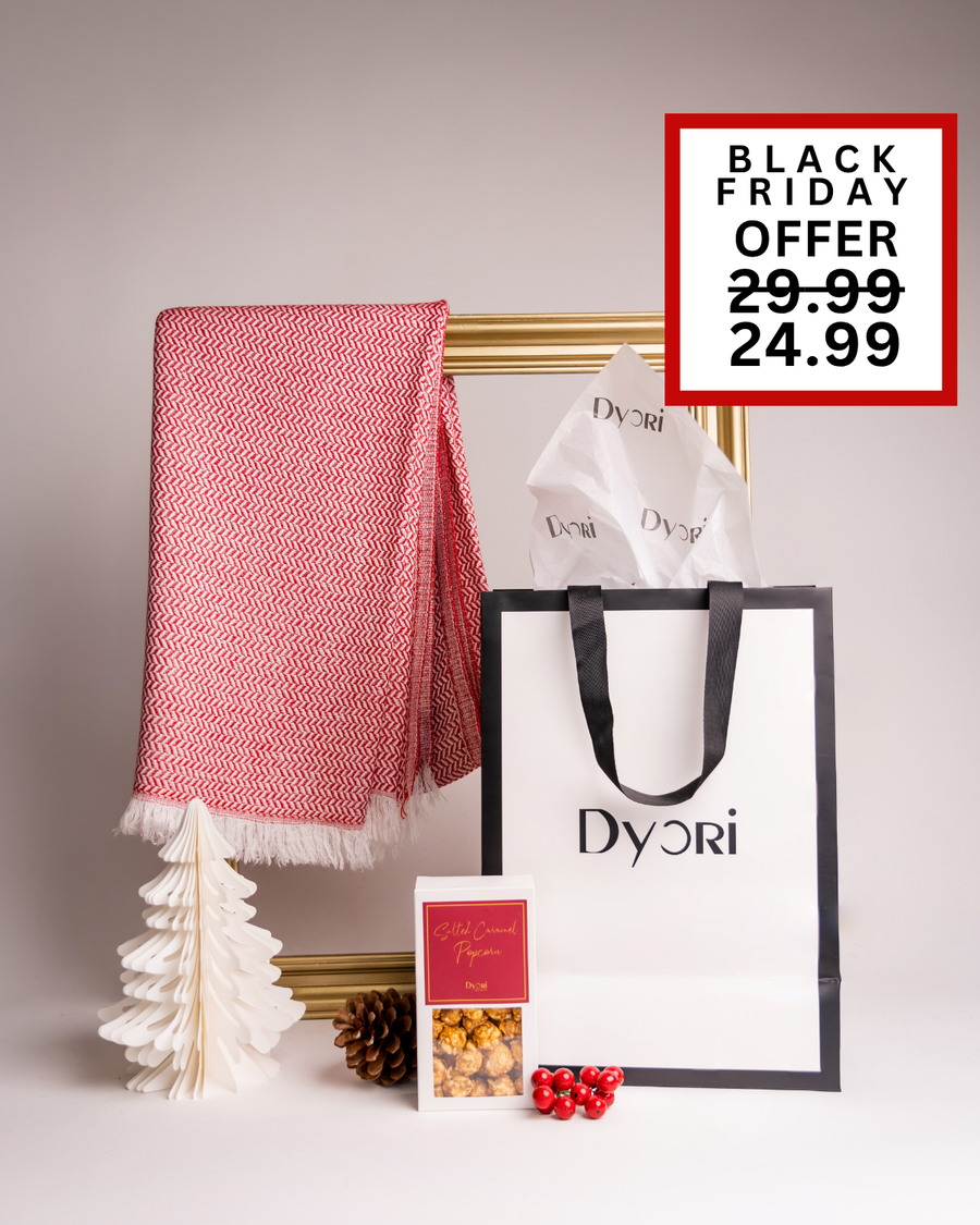 A bright and festive Dyori set with a red herringbone scarf, popcorn, and elegant packaging. A joyful Christmas gift idea perfect for anyone in Malta.