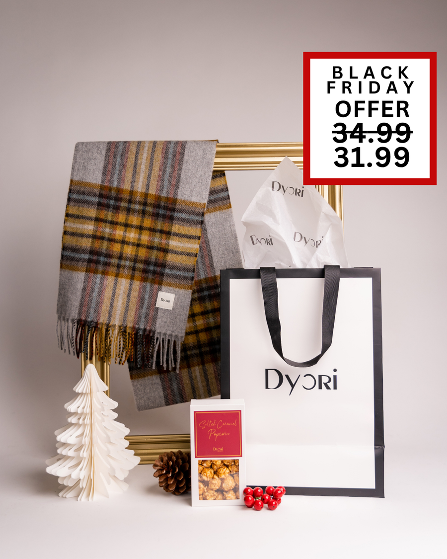 A chic Dyori gift set including a soft grey plaid scarf, popcorn, and festive packaging. Ideal as a modern Christmas or corporate gift in Malta.
