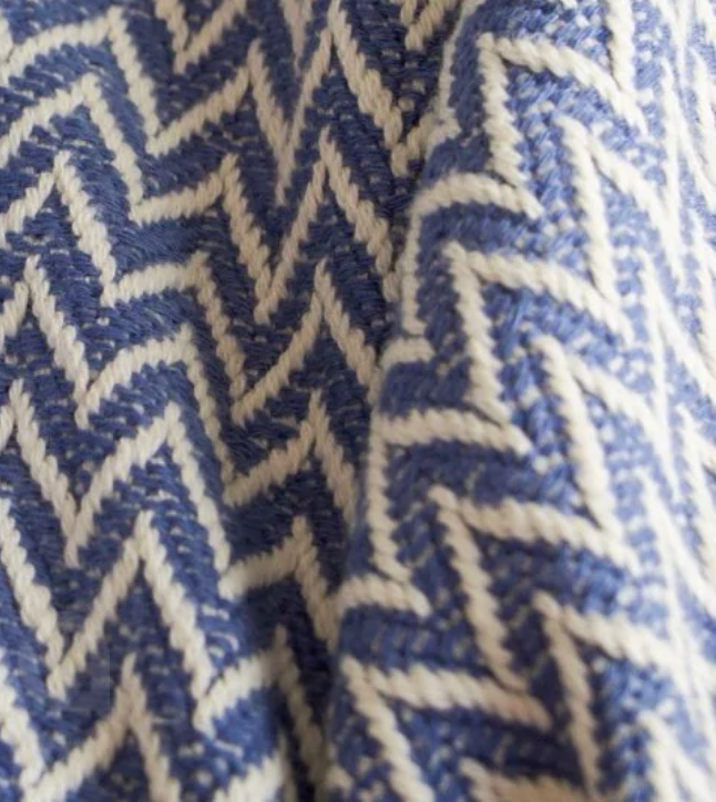 Dyori Indigo Wave Turkish Cotton Throw – 100% cotton blanket with a chevron weave in indigo blue and cream, handcrafted in Turkey for a soft and elegant home accen