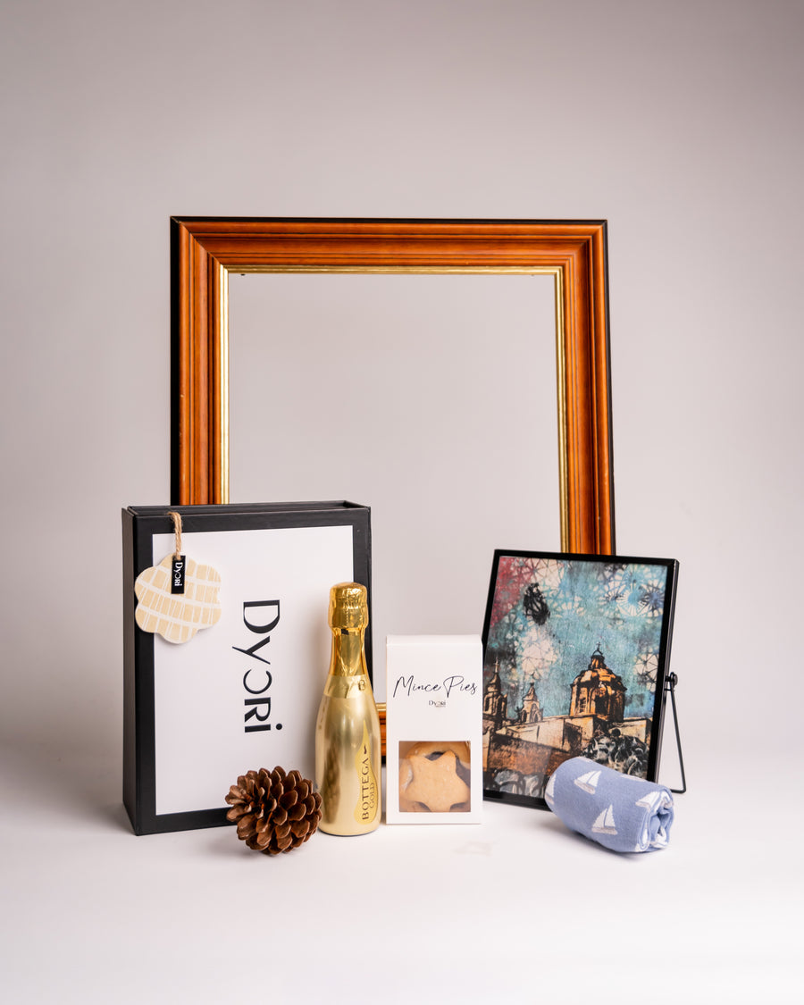 Luxury Christmas gift hamper by Dyori Malta featuring a golden Bottega prosecco bottle, artisan mince pies, a Malta-inspired art print, and eco-friendly packaging. The perfect festive hamper for men, women, teachers, or corporate gifting. Sustainable, luxury, and locally delivered — an ideal Christmas gift in Malta.