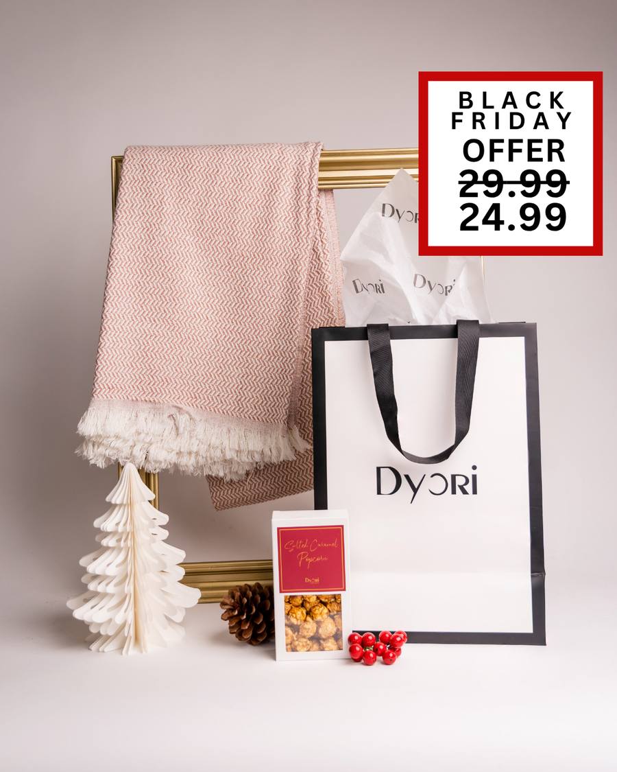 A chic and cozy luxury Christmas gift set by Dyori, featuring a soft blush herringbone throw, box of salted caramel popcorn, and elegant packaging. Ideal for the festive season or as a thoughtful holiday present. Don’t miss the Black Friday offer in Malta.