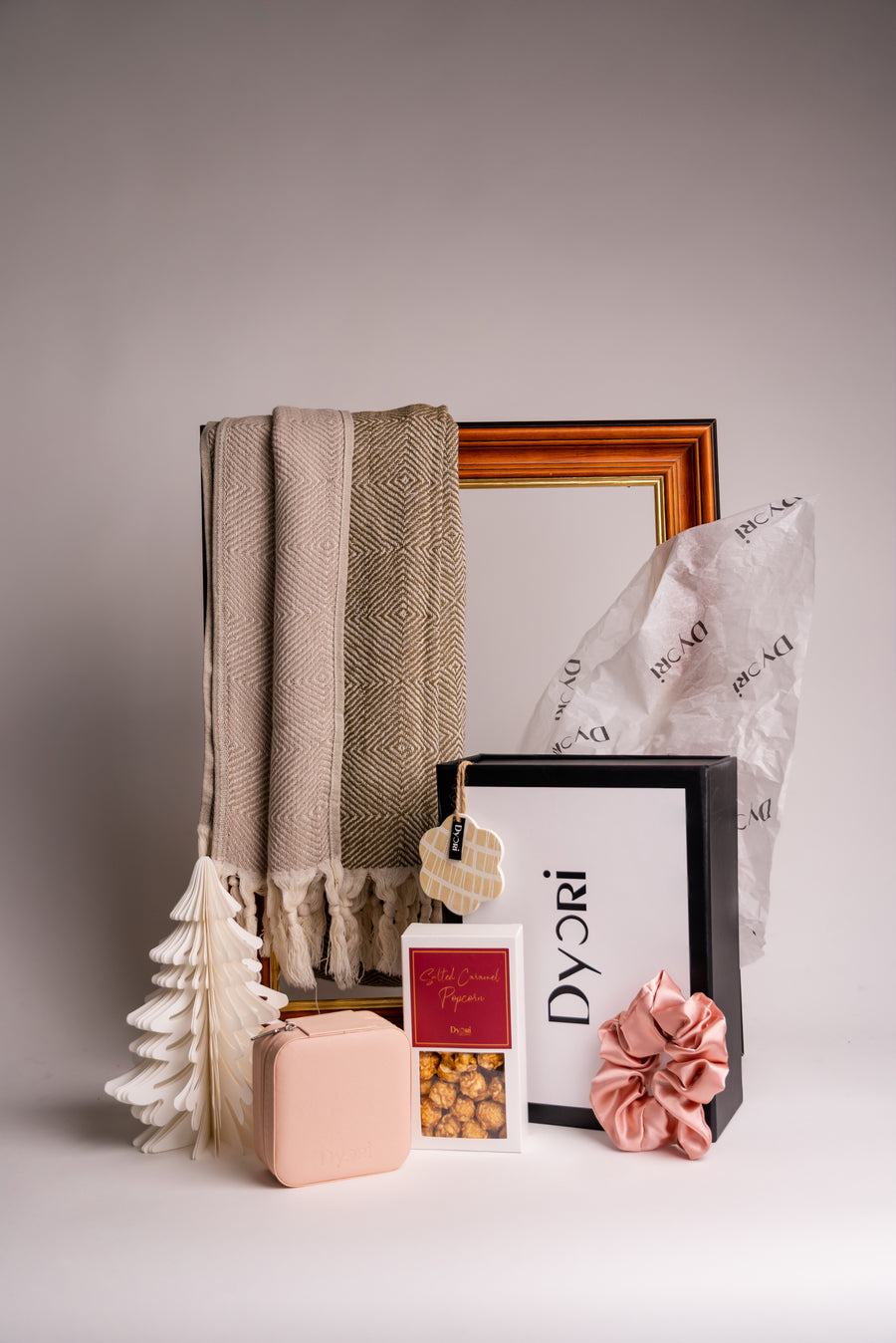 Luxury sustainable gift hamper from Dyori Malta featuring a beautifully woven eco-friendly scarf, salted caramel popcorn, silk scrunchie & keepsake accessories. Ideal for men’s gifts, women’s gifts, teachers’ gifts, or corporate presents. Locally packed, sustainable, and available for delivery across Malta.