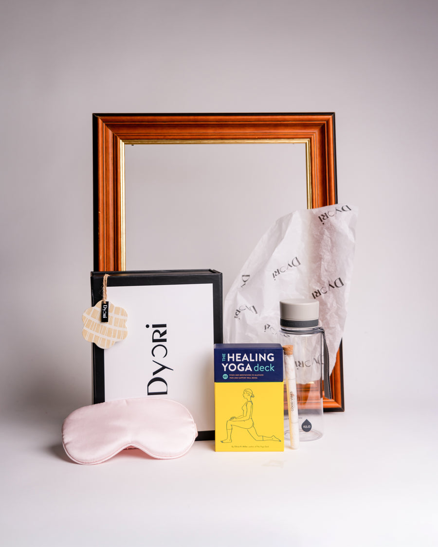 Luxury wellness gift hamper by Dyori Malta featuring a pink silk sleep mask, healing yoga deck, glass water bottle, and eco packaging. Ideal sustainable gift for men, women, teachers, or corporate clients. Perfect for Christmas gifts, birthday presents, or luxury hampers in Malta. Locally delivered and elegantly gift-packed.
