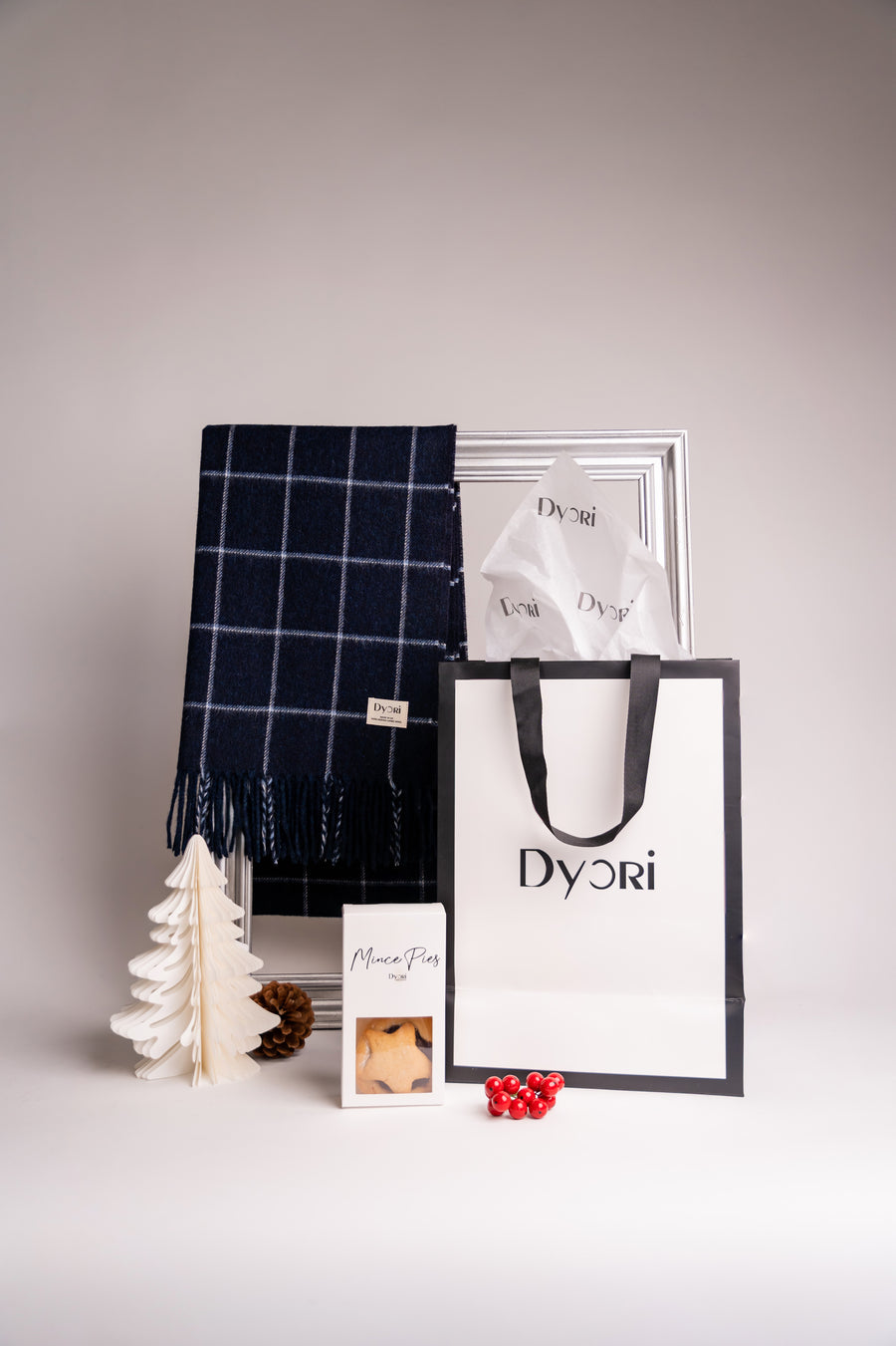 Navy blue merino wool scarf with classic white windowpane check pattern and soft fringe