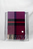 Elegant merino wool scarf in bold plum and mulberry check design with soft fringes. Premium craftsmanship meets modern sophistication — a perfect fashion gift for men or women in Malta.