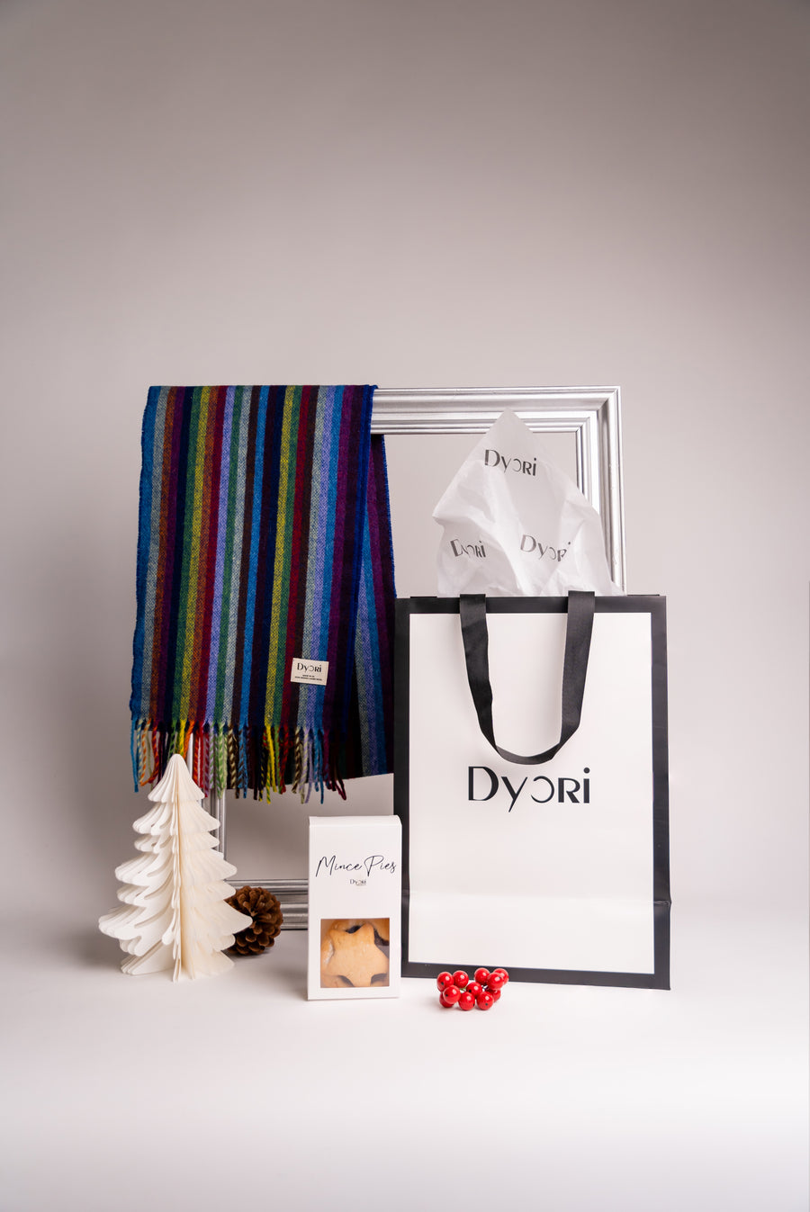 Colourful striped wool scarf featuring bold shades of blue, green, yellow, and purple - soft woven texture with fringed ends