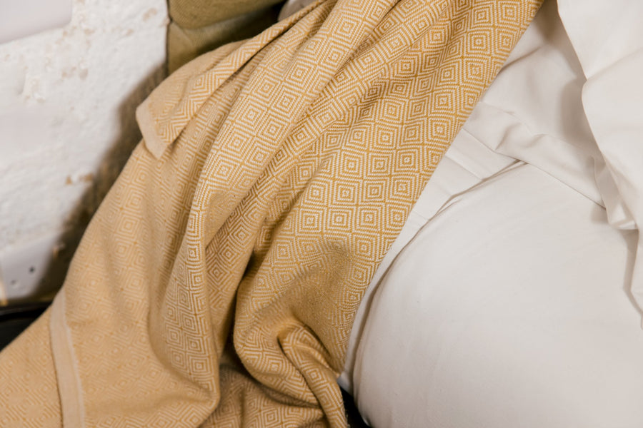Turkish cotton mustard diamond weave blanket with Dyori gift bag and salted caramel popcorn.