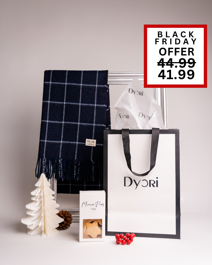 A classy Dyori navy check scarf paired with mince pies and a gift bag. A refined Christmas present ideal for men or women in Malta.