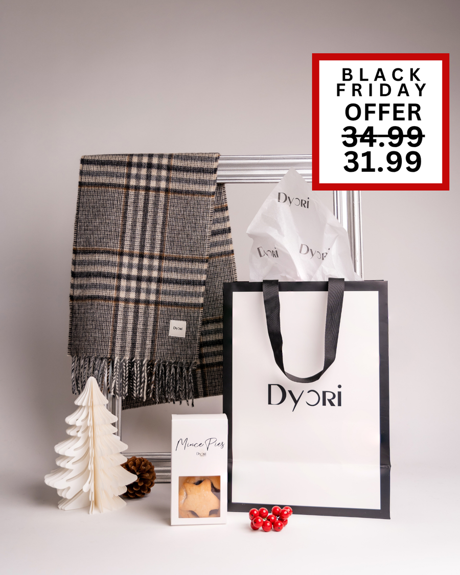A neutral-toned Dyori plaid scarf paired with mince pies and luxury packaging. A versatile Christmas gift perfect for anyone in Malta.