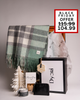 A festive Dyori gift box featuring a soft green scarf, candle, wallet, and mince pies. A beautiful Christmas gift option for her or corporate clients, available during the Black Friday sale in Malta.