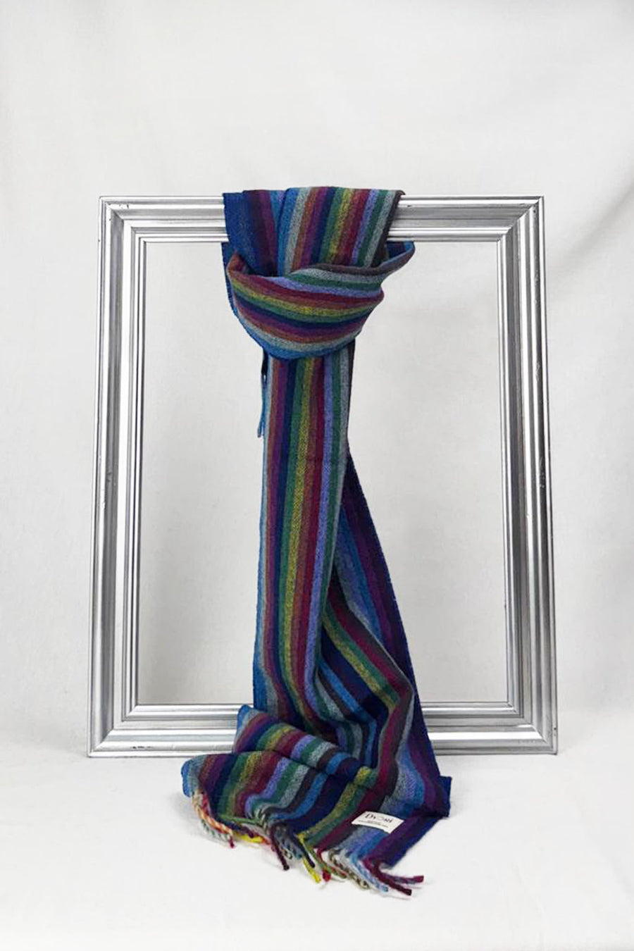 Luxurious merino wool scarf featuring bold rainbow stripes and fine fringe details. Cozy, warm, and timeless — an ideal gift for men or women. Delivered in Malta.