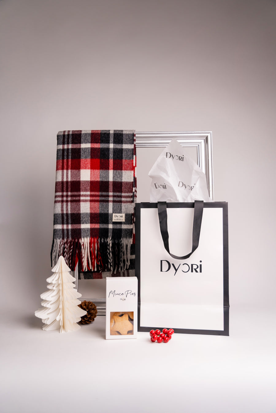 Red and black tartan merino wool scarf with classic pattern and soft fringe