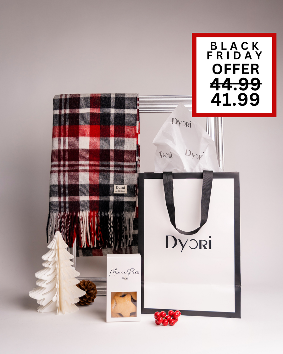 A vibrant red and black check Dyori scarf with mince pies and luxury packaging. A cheerful and cozy Christmas gift available in Malta.