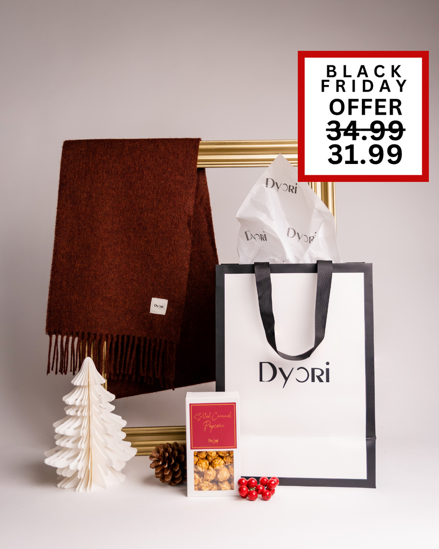 A rich rust-brown Dyori scarf paired with salted caramel popcorn and a luxury bag. A stylish Christmas gift idea perfect for him or her, available for delivery across Malta.