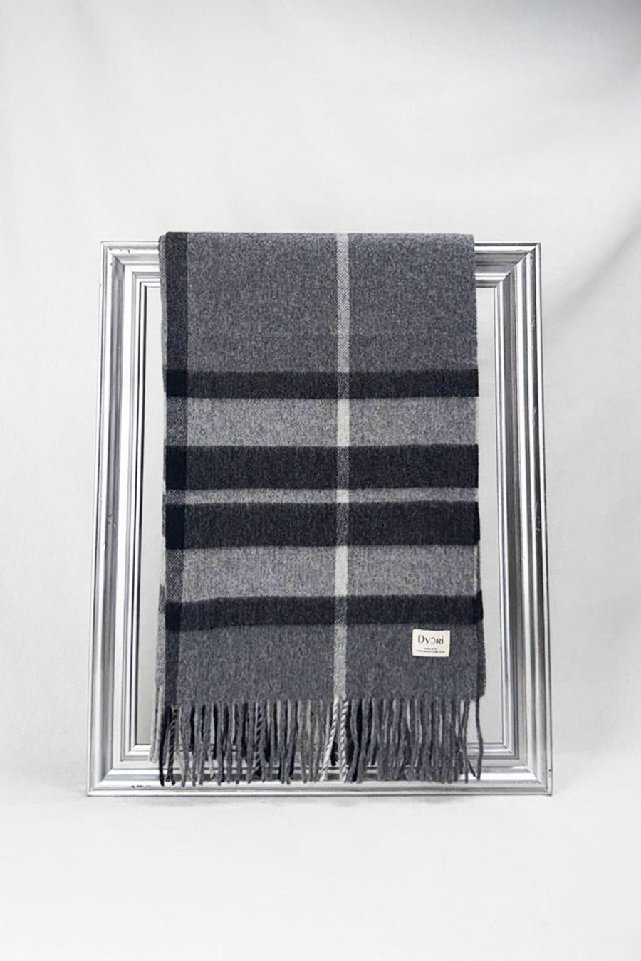 Premium quality merino wool scarf featuring grey and black tones in a refined checked design. Cozy, durable, and effortlessly stylish — a must-have winter gift.