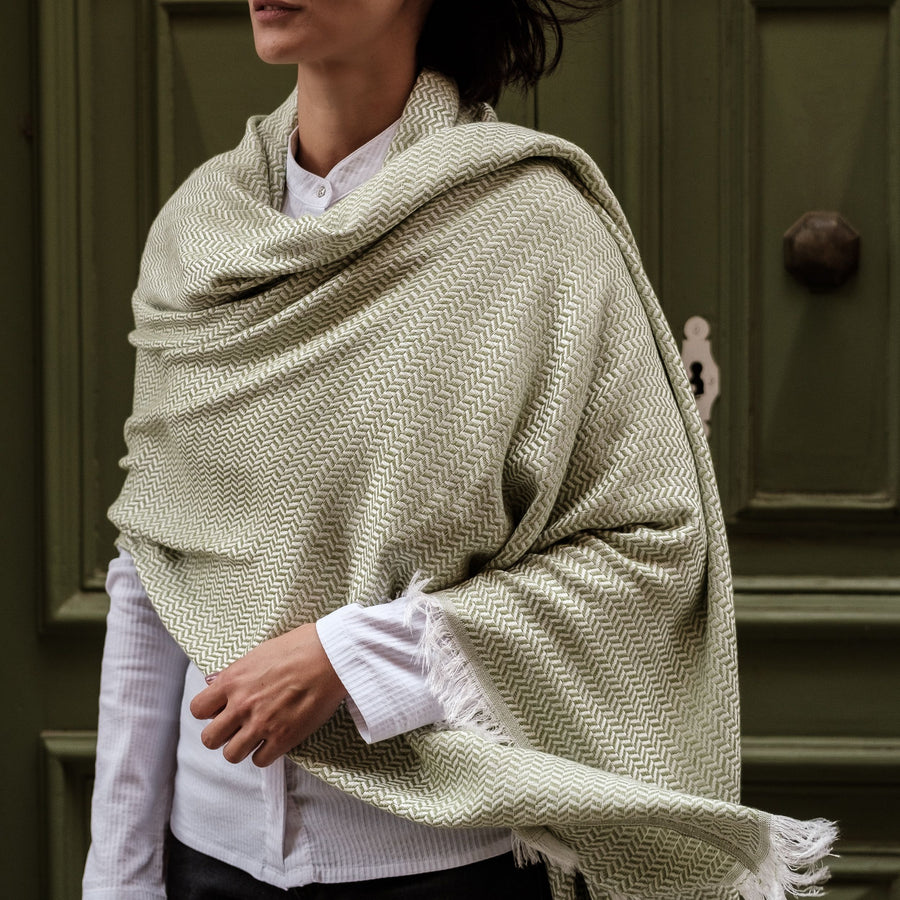Dyori Spring Sage Bamboo and Cotton Shawl – Light green and cream Turkish shawl with a subtle herringbone weave, soft texture, and fringed edges, perfect for a fresh, elegant look in any season.