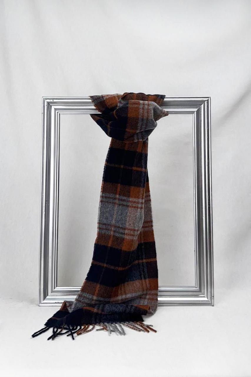 Dyori’s stylish plaid scarf crafted with sustainable materials, offering warmth, elegance, and comfort – perfect for gifting or everyday wear.
