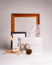 Unique baby gift hamper by Dyori Malta featuring a luxury baby journal, handmade crochet rattle, soft wooden brush, and “Good Vibes” candle. A sustainable, locally delivered gift for new parents — beautifully packaged for baby showers, christenings, or corporate baby gifts in Malta.