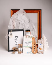 Dyori kitchen-themed gift set with designer tea towel, olive wood utensil, gourmet crackers, botanical spices and pineapple jam – perfect unique gifts in Malta.