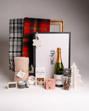 Dyori luxury Christmas gift set featuring champagne, soft blankets, mince pies, artisan chocolate, jewellery and festive accessories – perfect premium Christmas gifts in Malta