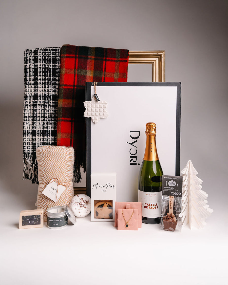 Dyori luxury Christmas gift set featuring champagne, soft blankets, mince pies, artisan chocolate, jewellery and festive accessories – perfect premium Christmas gifts in Malta