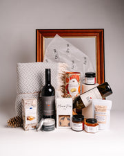 Dyori luxury corporate gift hamper with premium wine, gourmet snacks, soft blankets, mince pies, artisanal candle and spreads – perfect high-end corporate gifts in Malta