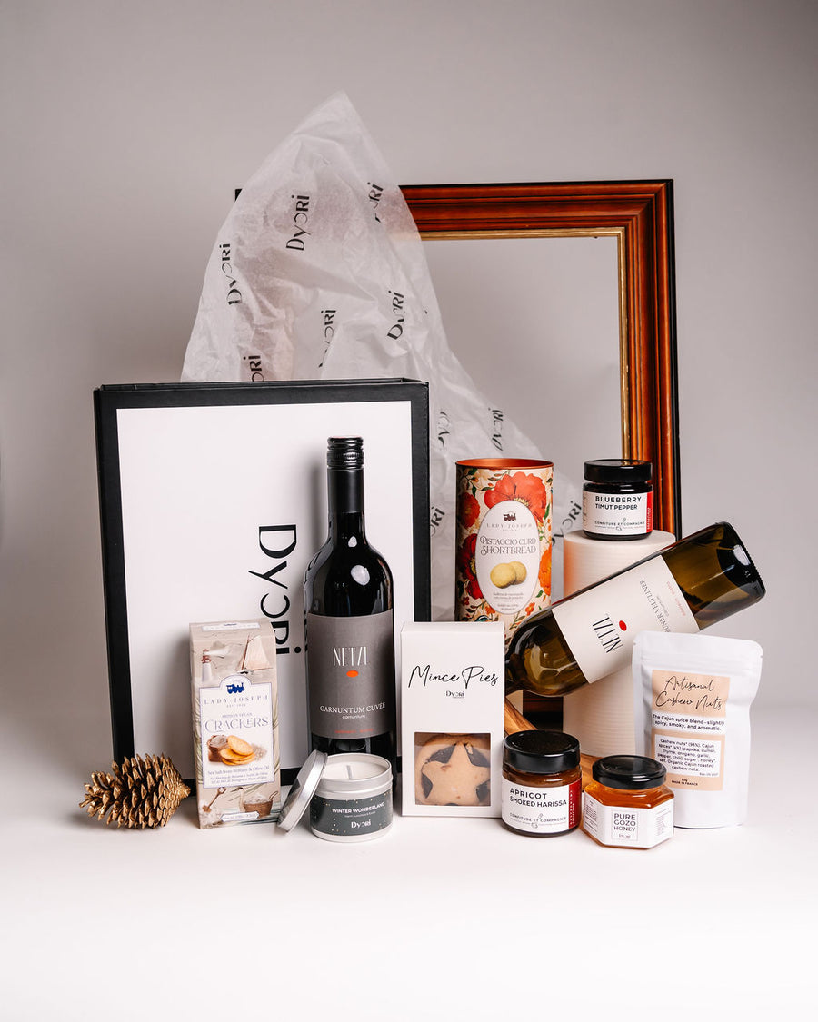 Dyori luxury corporate gift hamper with premium red and white wine, gourmet crackers, artisan shortbread, mince pies, candle, spreads and nuts – ideal high-end corporate gifts in Malta